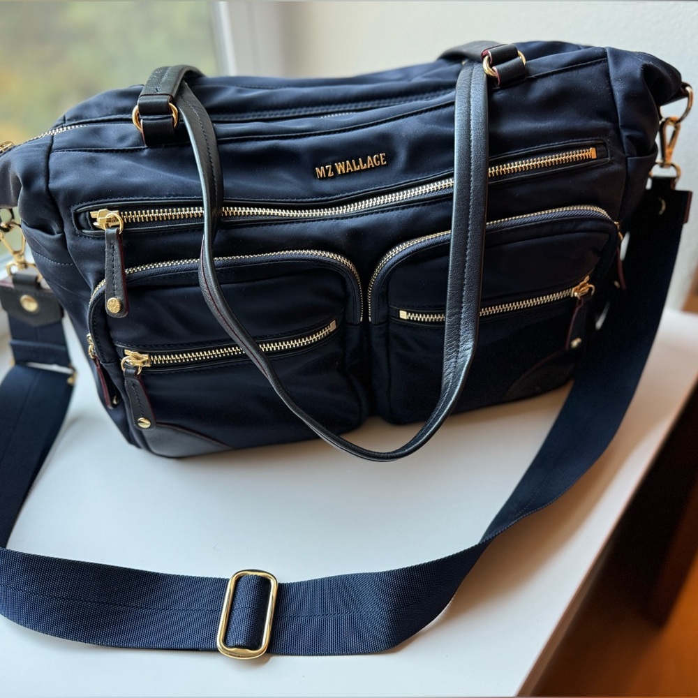 MZ Wallace gorgeous “Travel Jimmy” with gold detailing. dark navy blue .